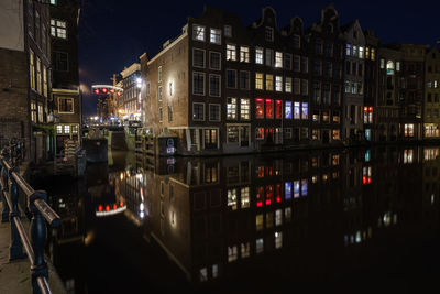 View of buildings in city at night