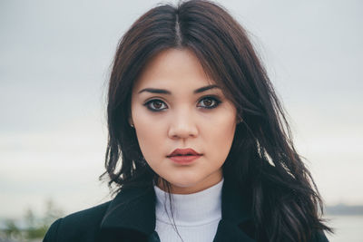 Close-up portrait of beautiful young woman outdoors