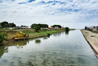 View of river against cloudy sky