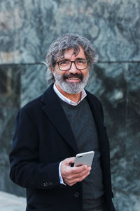 Portrait of young man using mobile phone