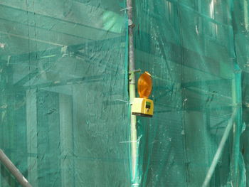 Low angle view of lighting equipment on scaffolding at construction site