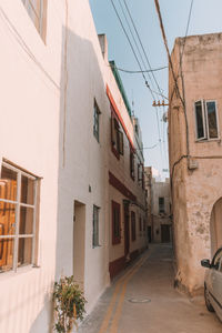 Street amidst buildings in city against sky