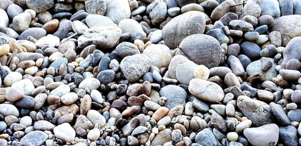 Full frame shot of pebbles on beach