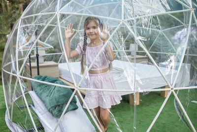 Portrait of smiling girl standing outdoors