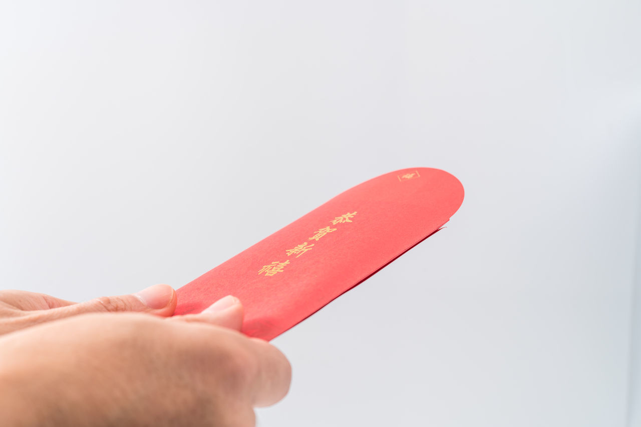 hand, finger, one person, holding, red, studio shot, indoors, close-up, adult, copy space, white background, lip