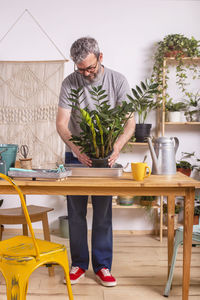 Full length of man standing on table