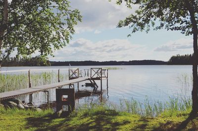 Scenic view of lake against cloudy sky