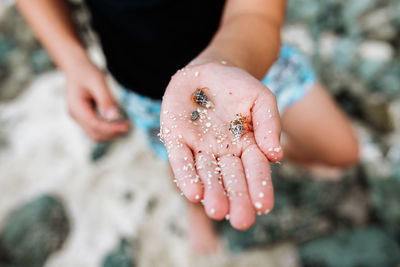 Close-up of hand holding sand