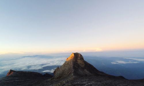 Scenic view of mountains against sky during sunset