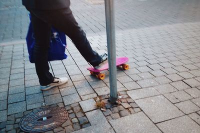 Woman standing on sidewalk