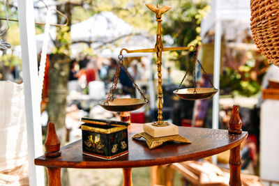 Close-up of lamp hanging on table at temple