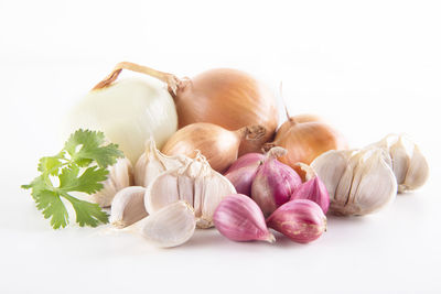 Close-up of garlic against white background