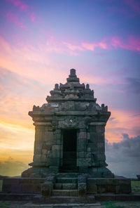 Historic building against sky during sunset