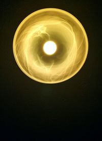 Low angle view of illuminated light bulb