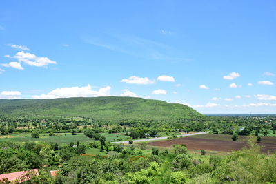 Scenic view of agricultural landscape against sky