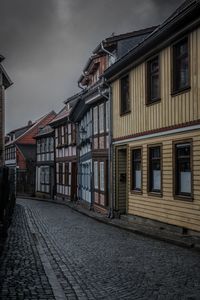 Residential buildings by street in city