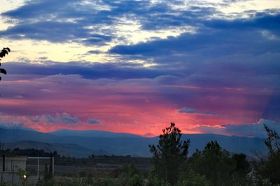 Scenic view of dramatic sky during sunset