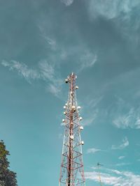 Low angle view of communications tower against sky