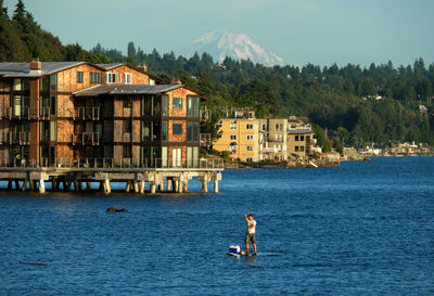 High angle view of man paddleboarding in sea