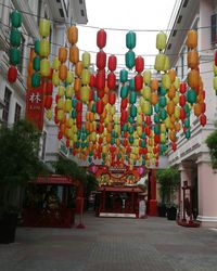 Multi colored lanterns hanging in row