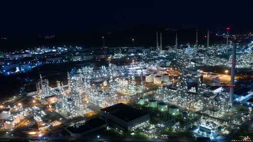 High angle view of illuminated buildings in city at night