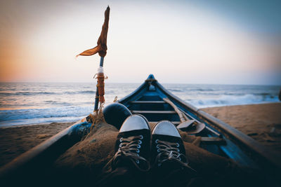 Low section of man relaxing on beach