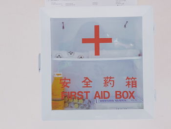 Close-up of warning sign on white box