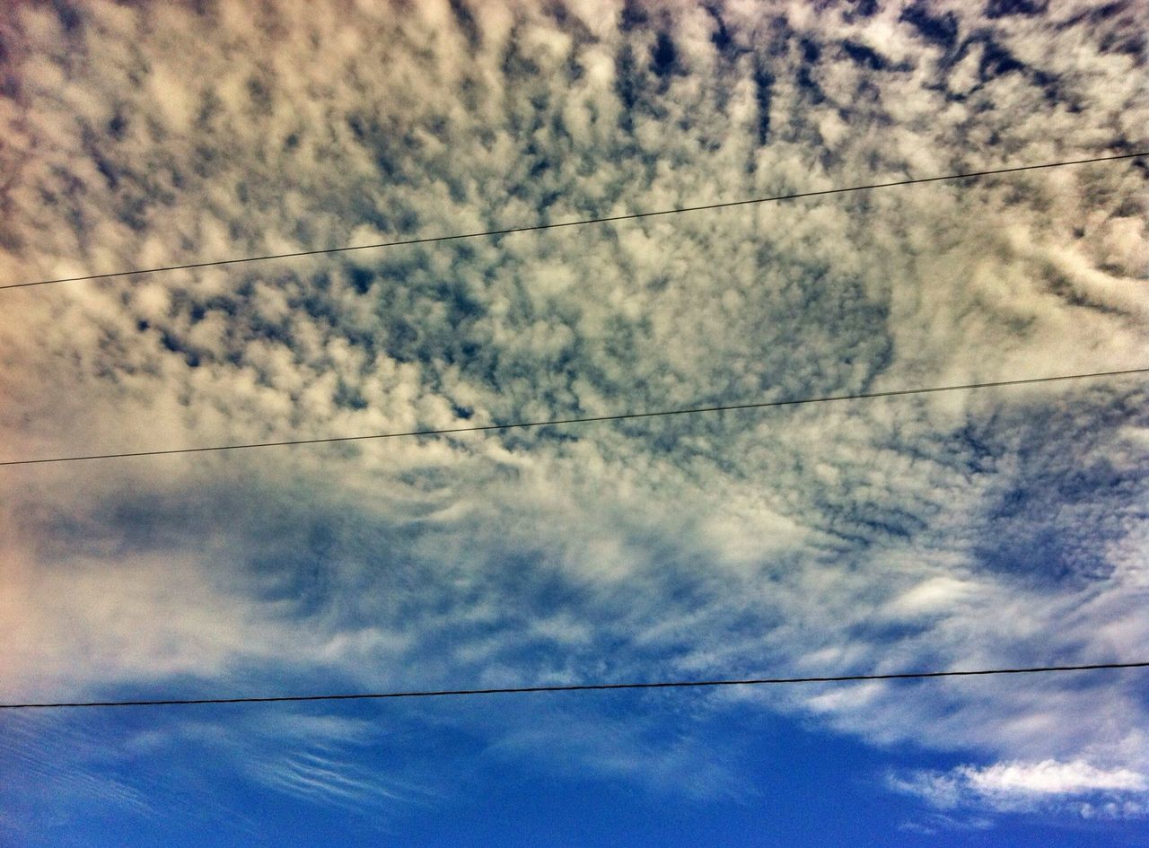 low angle view, sky, power line, cloud - sky, cable, cloudy, electricity, power supply, cloud, connection, electricity pylon, nature, tranquility, blue, beauty in nature, no people, power cable, outdoors, day, weather