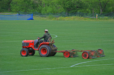 Man and tractor on field