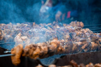 Close-up of meat on barbecue grill