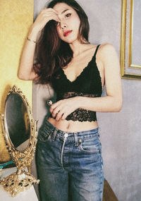 Portrait of woman standing at home