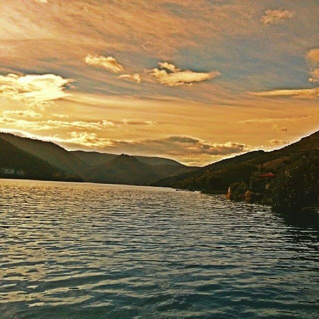 water, waterfront, rippled, sunset, tranquil scene, scenics, mountain, lake, tranquility, beauty in nature, nature, sky, river, idyllic, reflection, sea, outdoors, no people, cloud - sky, dusk