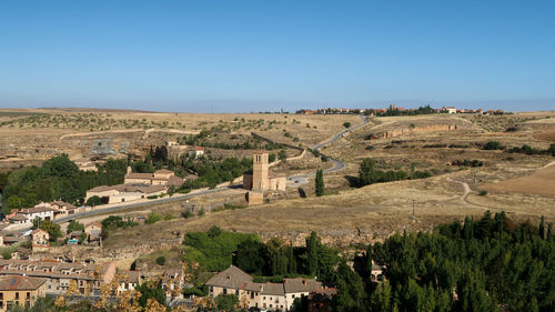 Panoramic view of landscape against clear blue sky