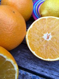 Close-up of oranges on wooden table