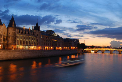 Bridge over river with buildings in background