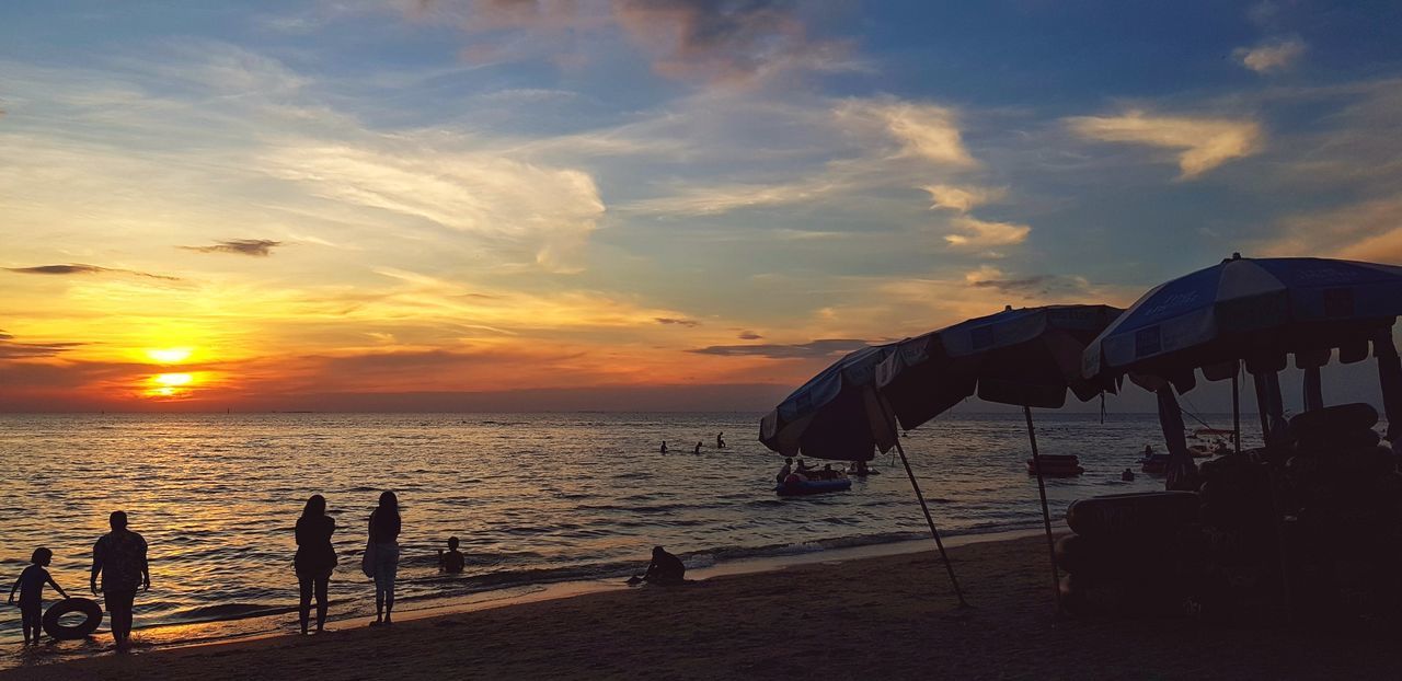 PEOPLE AT BEACH DURING SUNSET