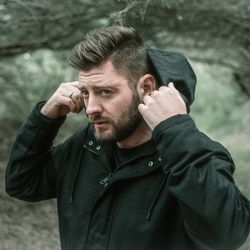 Portrait of man wearing warm clothing while standing outdoors