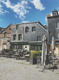 Houses on field against sky