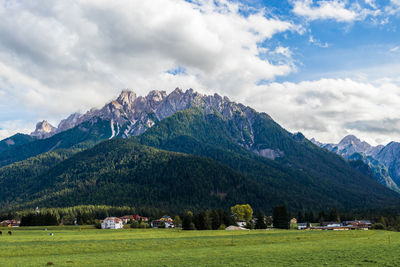 Scenic view of landscape and mountains against sky