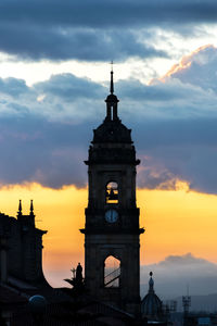 Silhouette primatial cathedral of bogota against cloudy sky