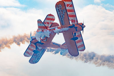 Low angle view of information sign against sky