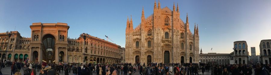 Group of people in front of building against sky