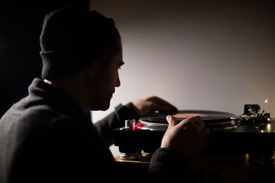 Man playing turntable