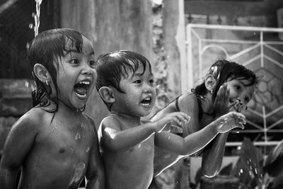 Siblings enjoying in water