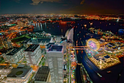 High angle view of illuminated city buildings at night