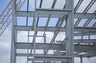 Low angle view of metallic structure against sky