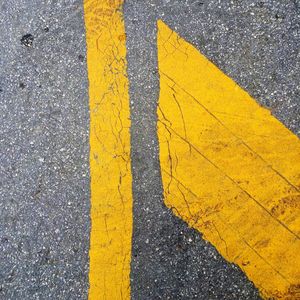 Close-up of yellow zebra crossing on road