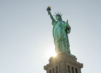 Low angle view of statue of liberty against clear sky