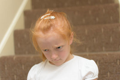 Close-up of angry girl at home