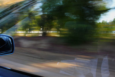 Cropped image of car on road